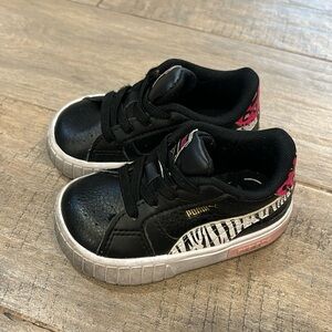 Puma Cali sneaker. Size 5C. Black with zebra and cheetah print.